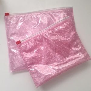 Glossier bags with samples & stickers